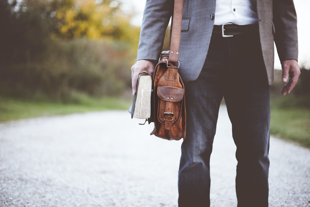 A person with a messenger bag